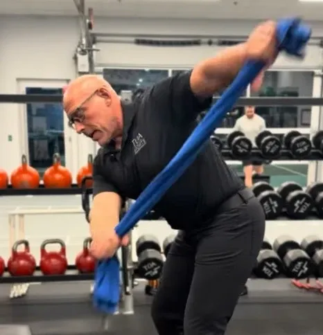 TOA trainer demonstrating stretching exercises